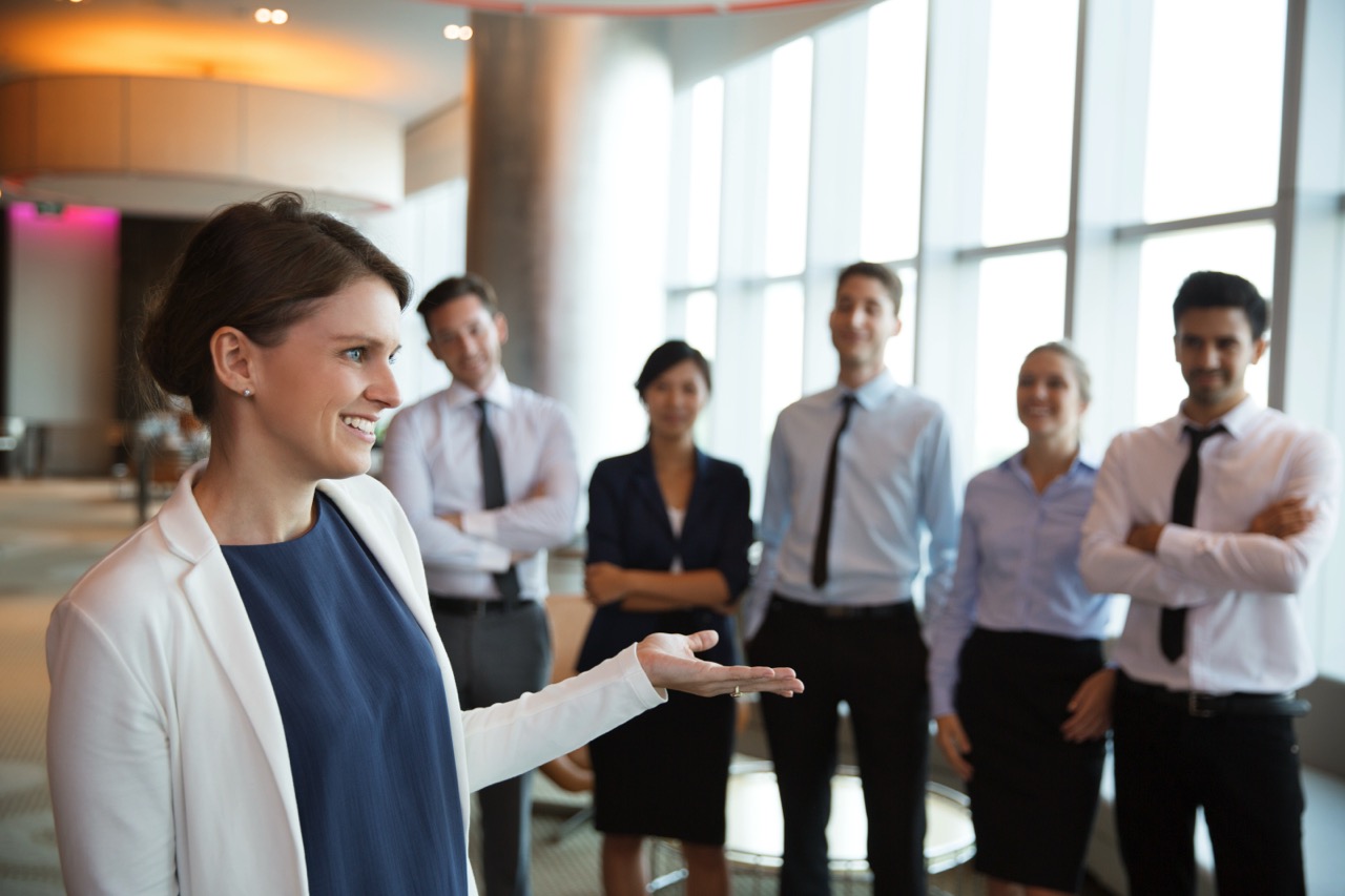Happy Female Executive Manager with Team
